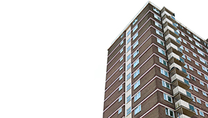 A block of flats against a grey sky